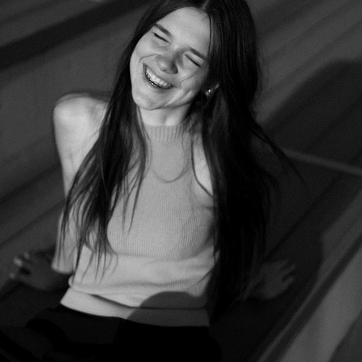 Kaveri Mehta, Lead Design Curator at Crest Point Works, reviewing corporate floral arrangements